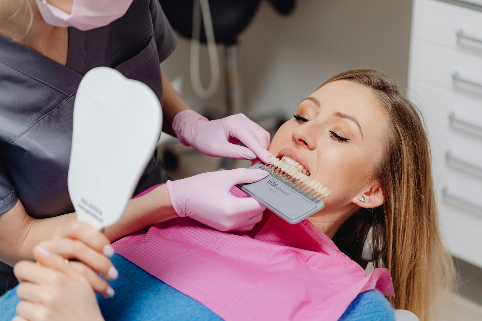 Dentist carrying out precise smile-design treatment in a modern clinic